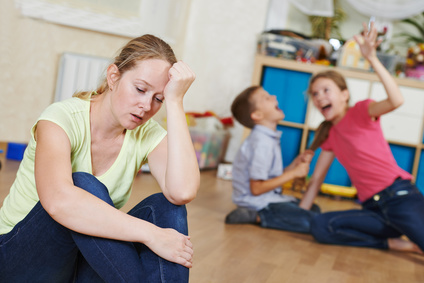exhausted mother frustrated and upset from children behaviour